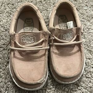 Toddler size 8 slip on shoes Hey Dude. A bit worn but still have some life!
